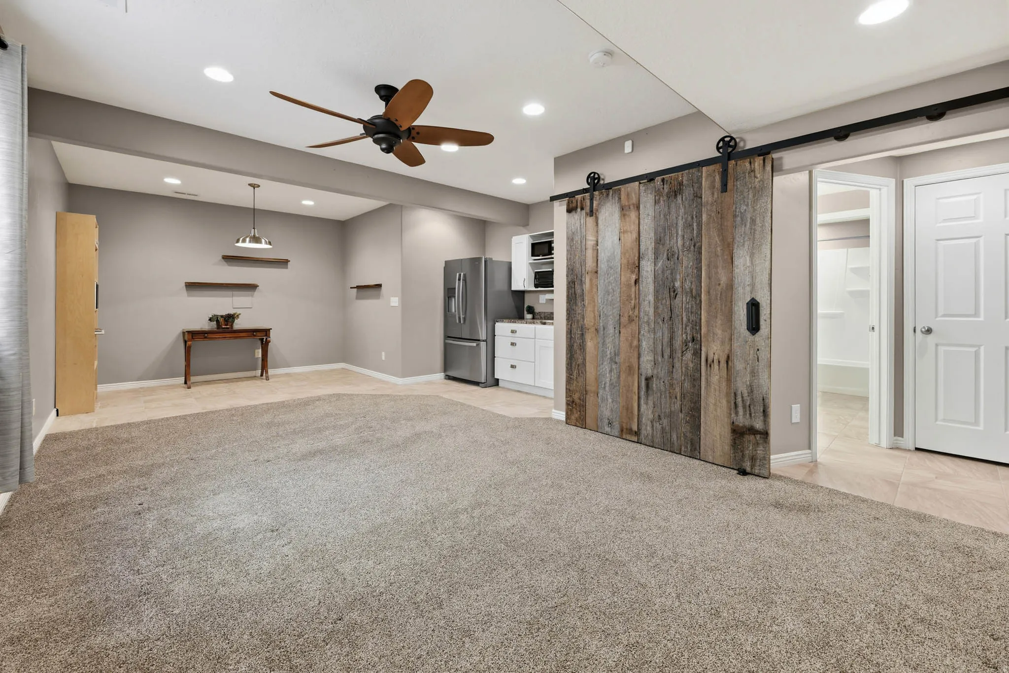 The entertainment room has plenty of room and a great dining space along with the kitchenette .