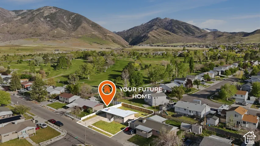Aerial perspective of suburban area with a mountain backdrop