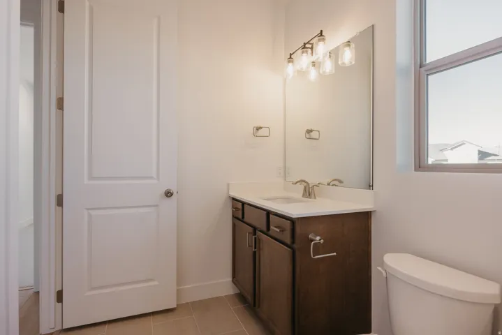 Bathroom featuring vanity and light tile patterned floors