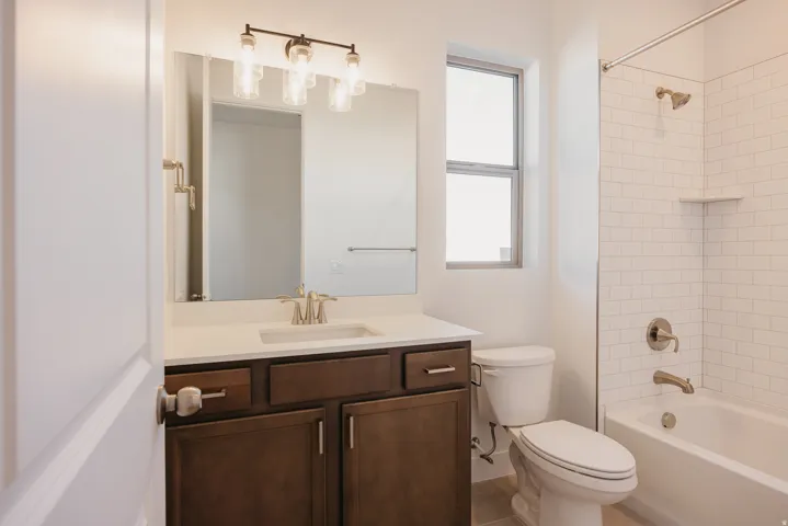 Full bath with vanity and shower / bath combination