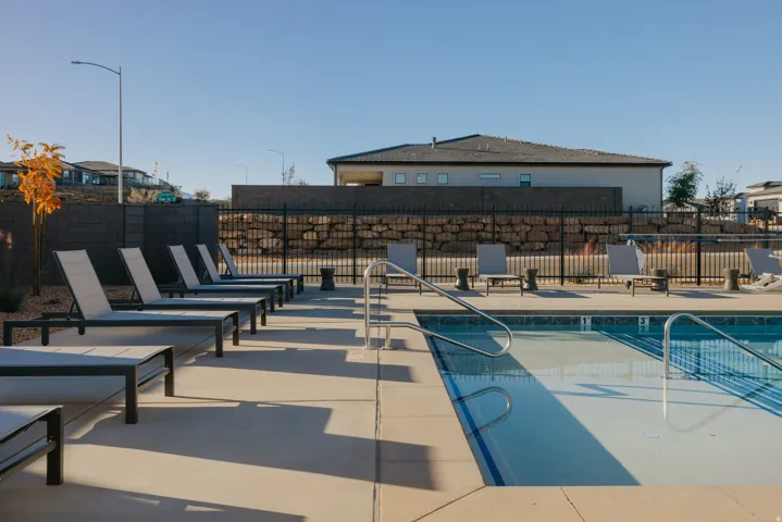 Community pool with a patio
