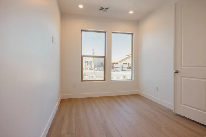 Unfurnished room with light wood-type flooring and recessed lighting