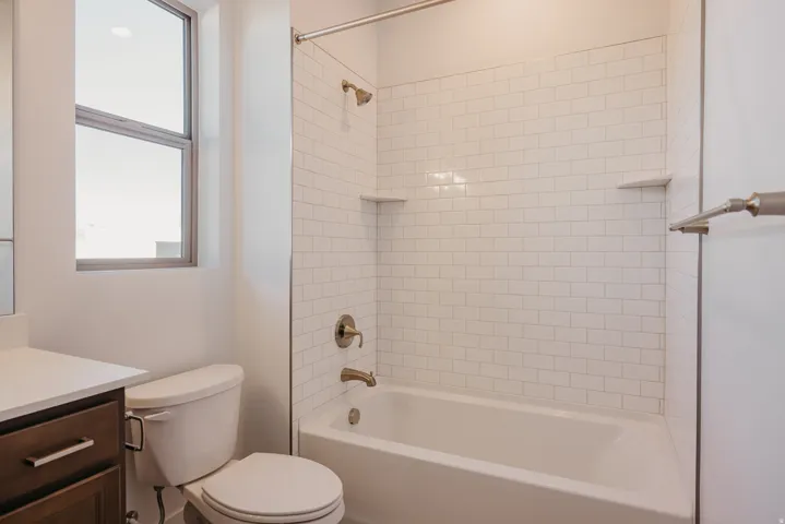 Full bath with vanity and shower / bath combination