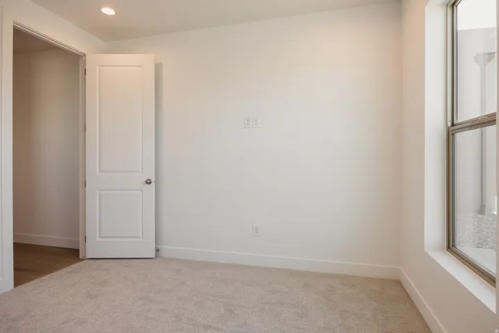Spare room with carpet floors and recessed lighting