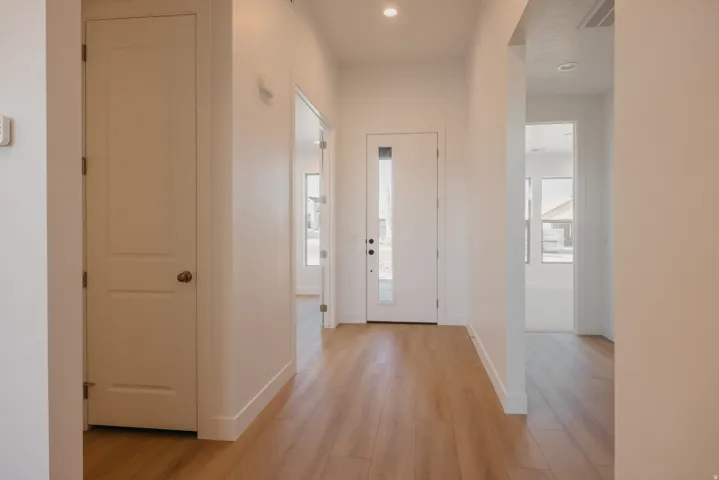 Entryway featuring light wood-type flooring and recessed lighting