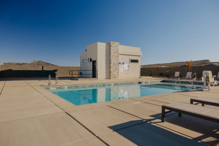 Community pool with a patio