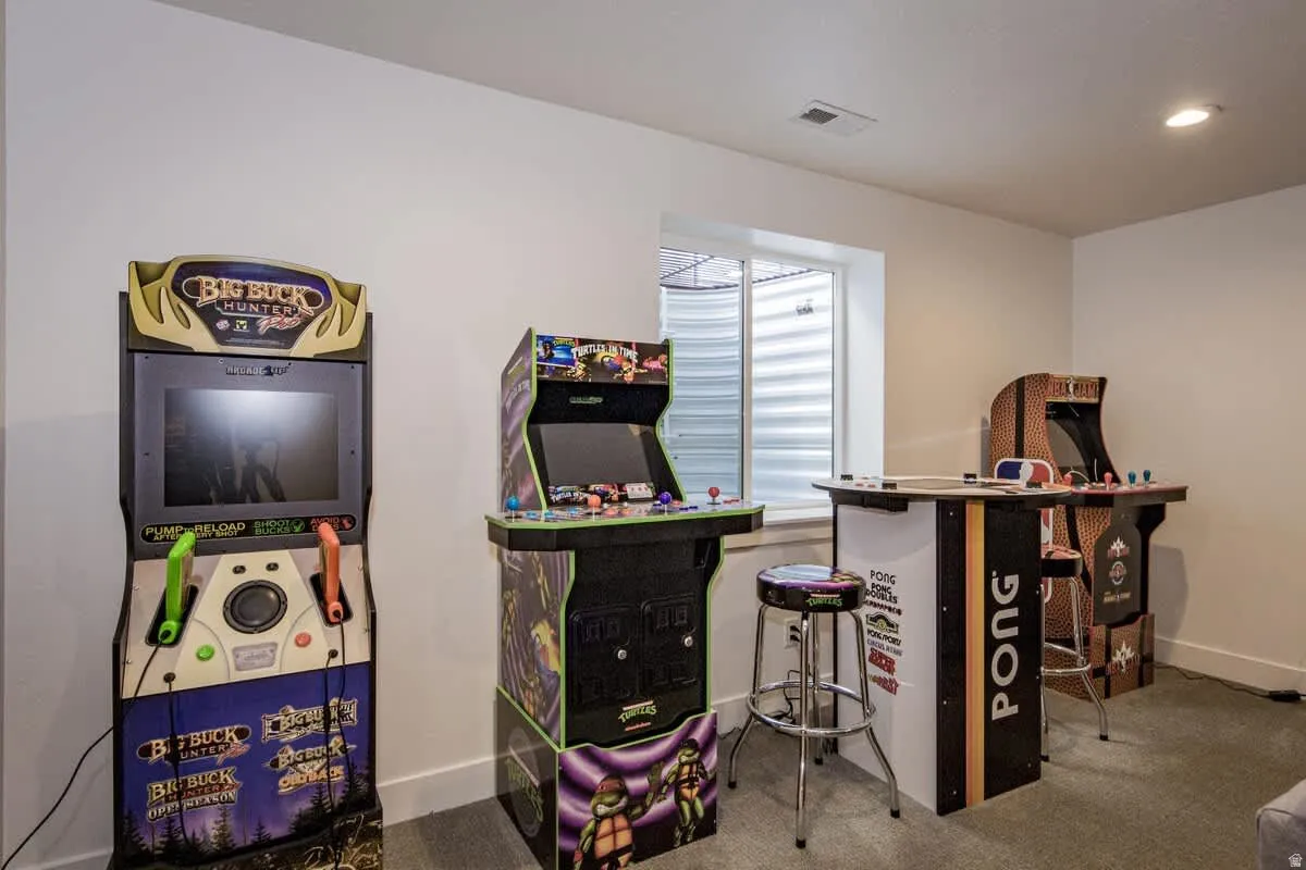Game room with carpet and baseboards