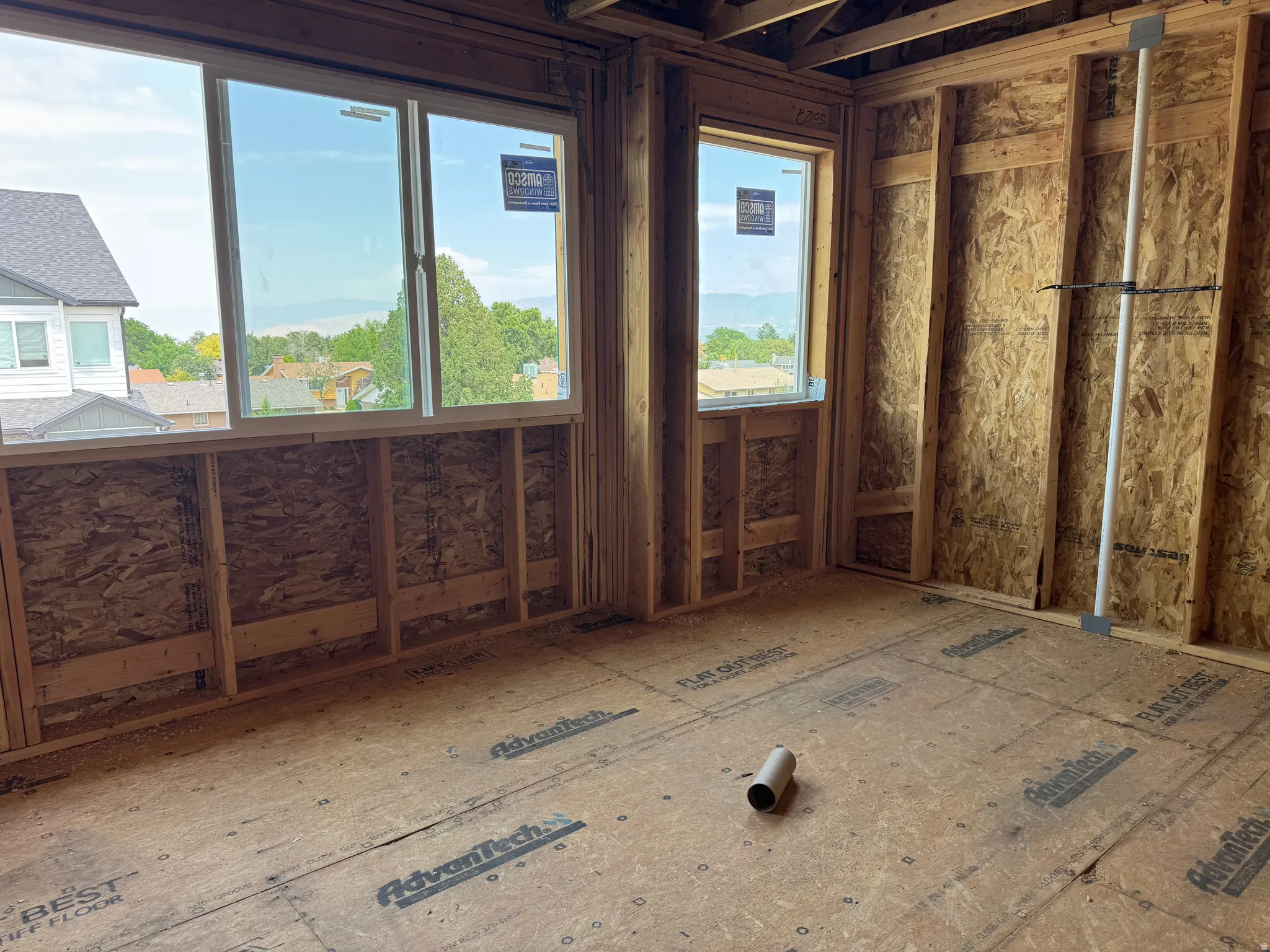 Framed interior room with two windows providing ample natural light