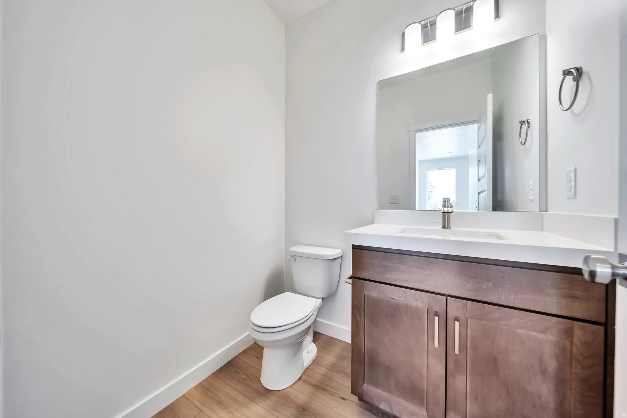 Bathroom with vanity and light wood-style flooring