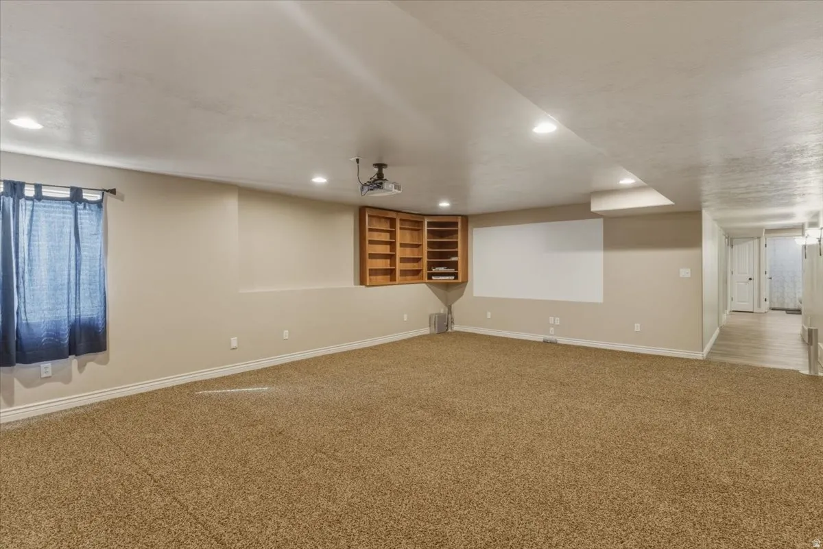Unfurnished room featuring carpet floors and recessed lighting
