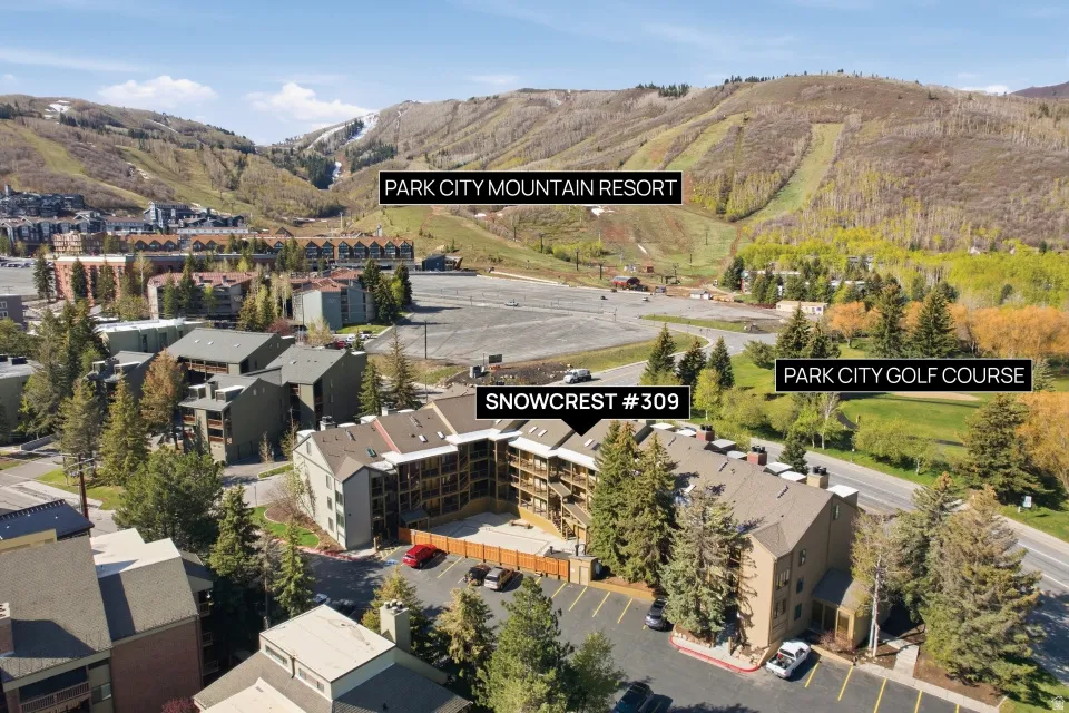 Aerial overview of property's location featuring a mountainous background