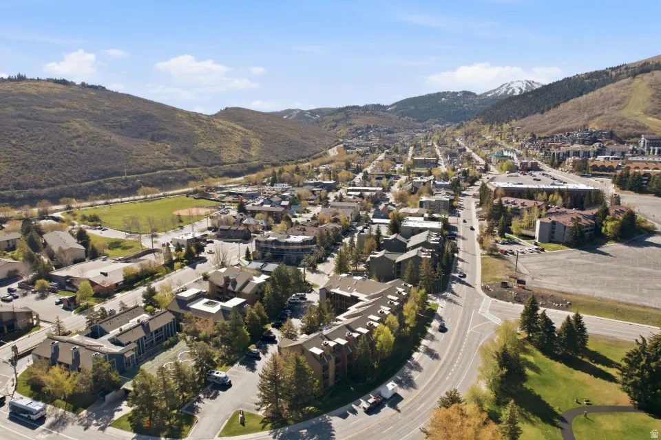 View of property location with mountains and nearby suburban area