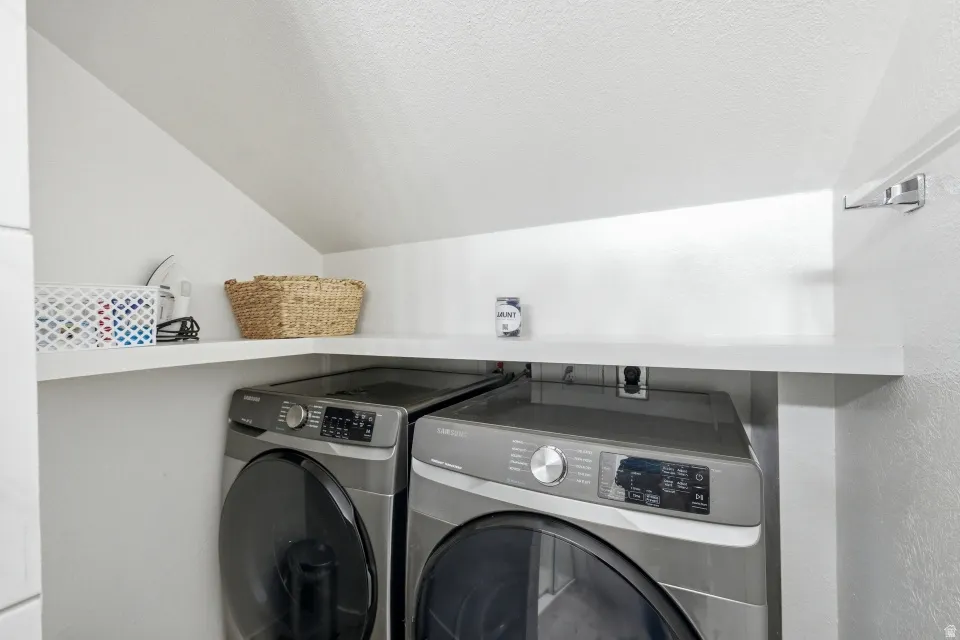 Laundry area with washing machine and clothes dryer