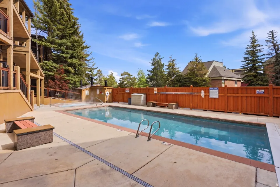 Community pool with a patio area