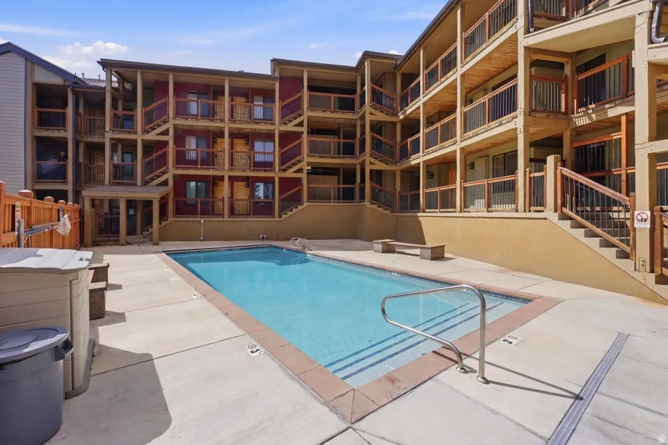 Community pool featuring a patio area