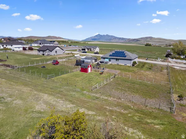 Overview of rural landscape featuring a mountainous background