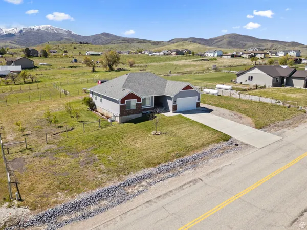 View of subject property with mountains