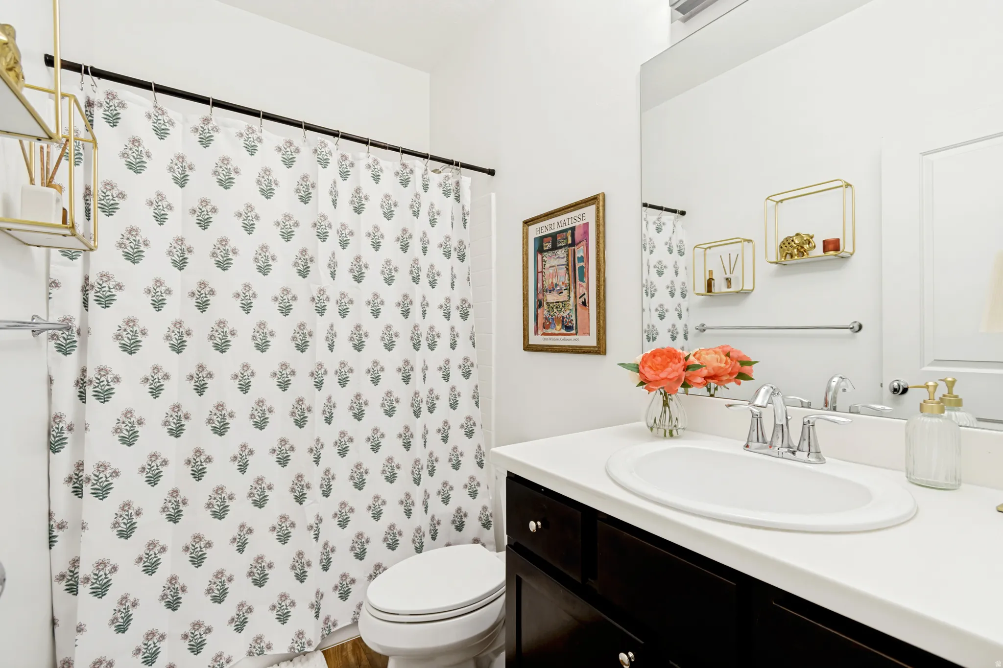 Bathroom featuring vanity and curtained shower