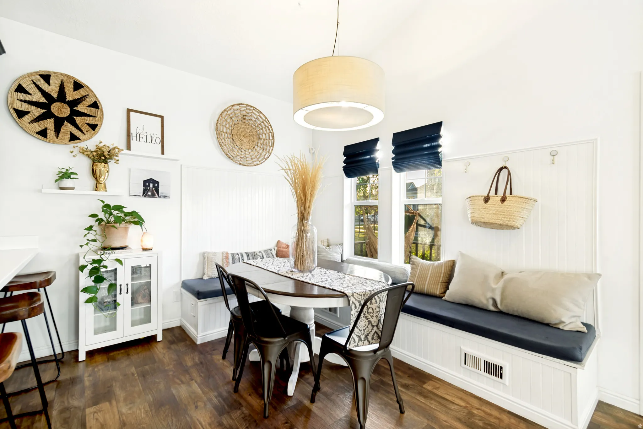 Dining area featuring breakfast area and dark wood-style floors