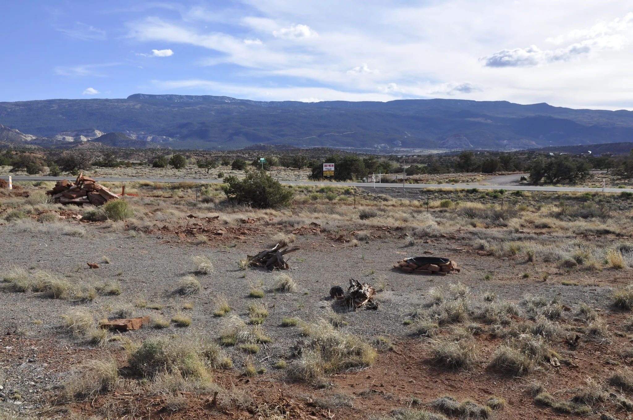 View of mountain backdrop with rural landscape