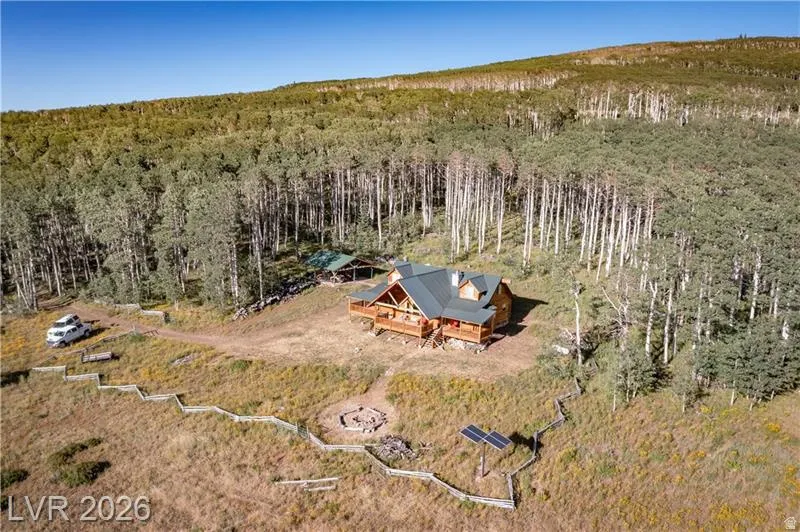 View of subject property featuring a heavily wooded area