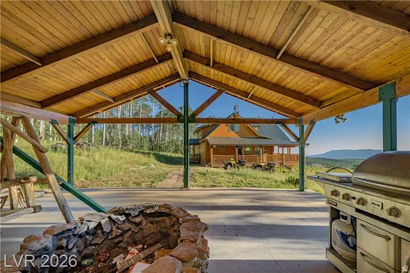 View of patio / terrace with grilling area and a mountain view