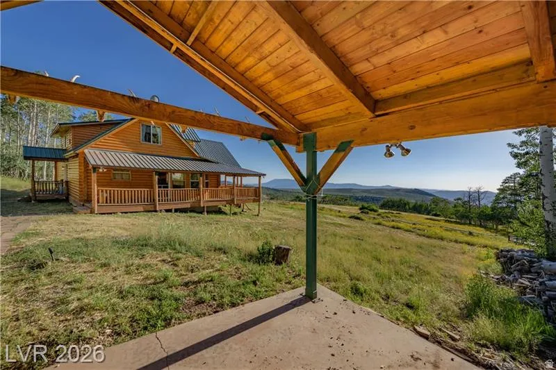 View of grassy yard featuring a mountain view