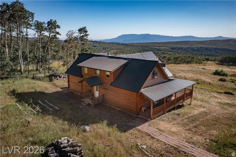 Aerial view of property and surrounding area with mountains
