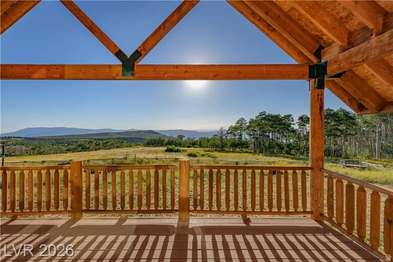 Wooden terrace featuring a mountain view