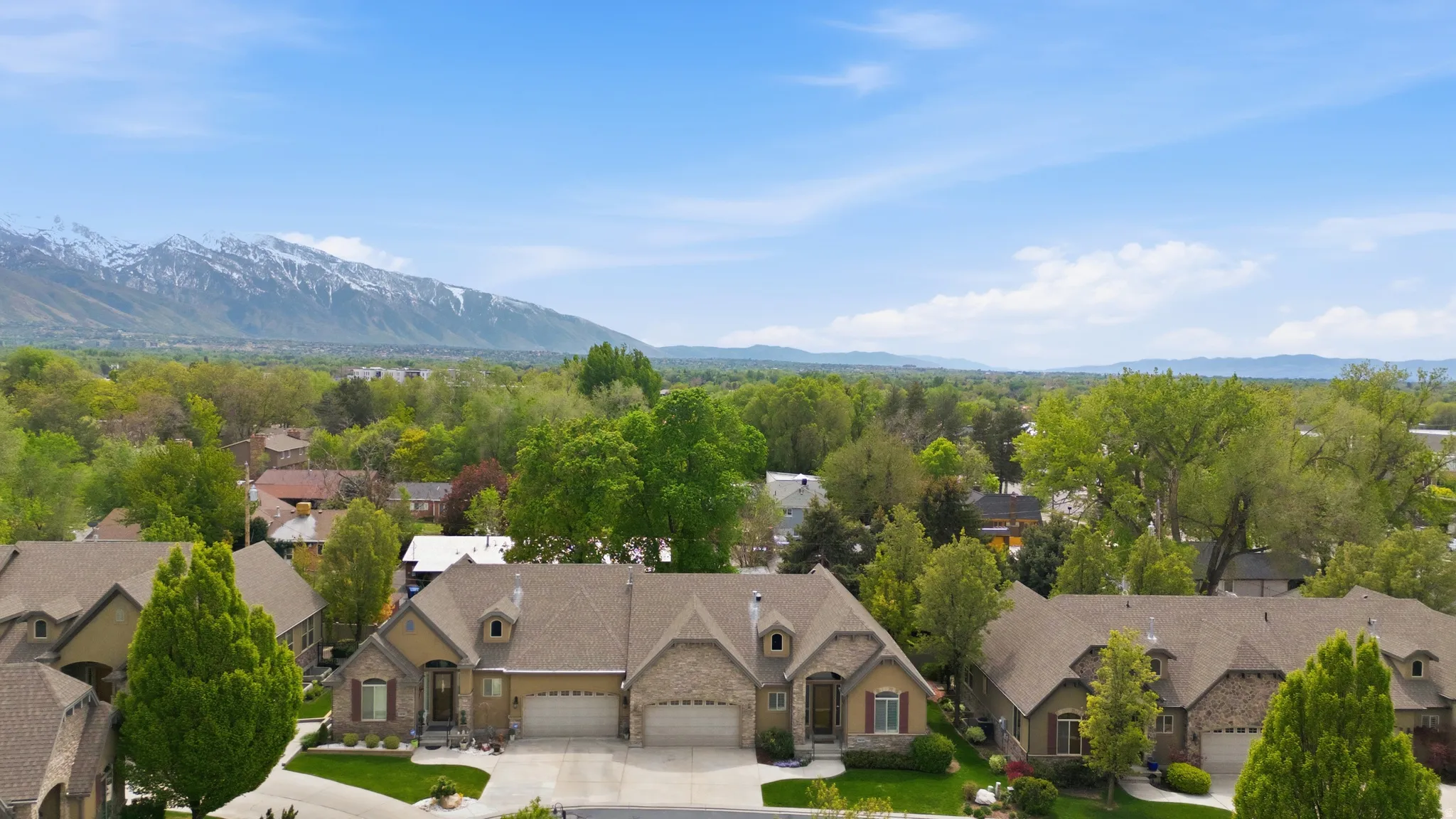 Aerial view of residential area featuring mountains