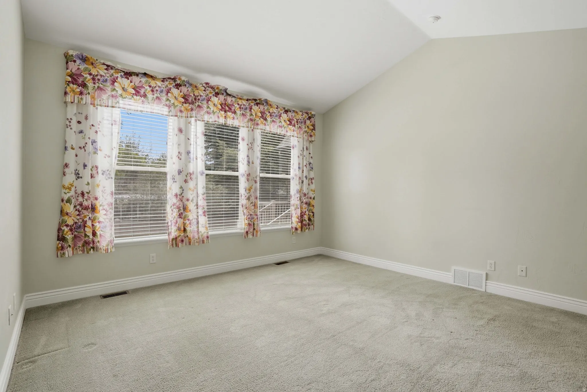 Primary bedroom with lots of natural light