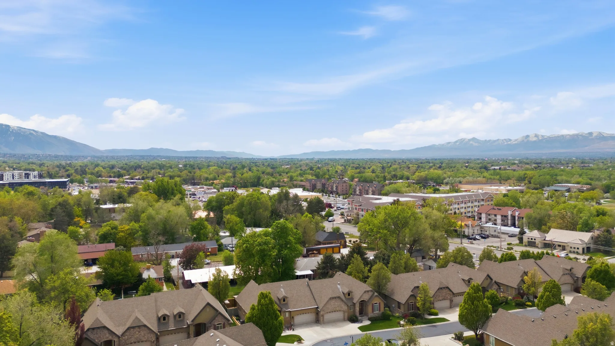 Aerial view of residential area with mountains