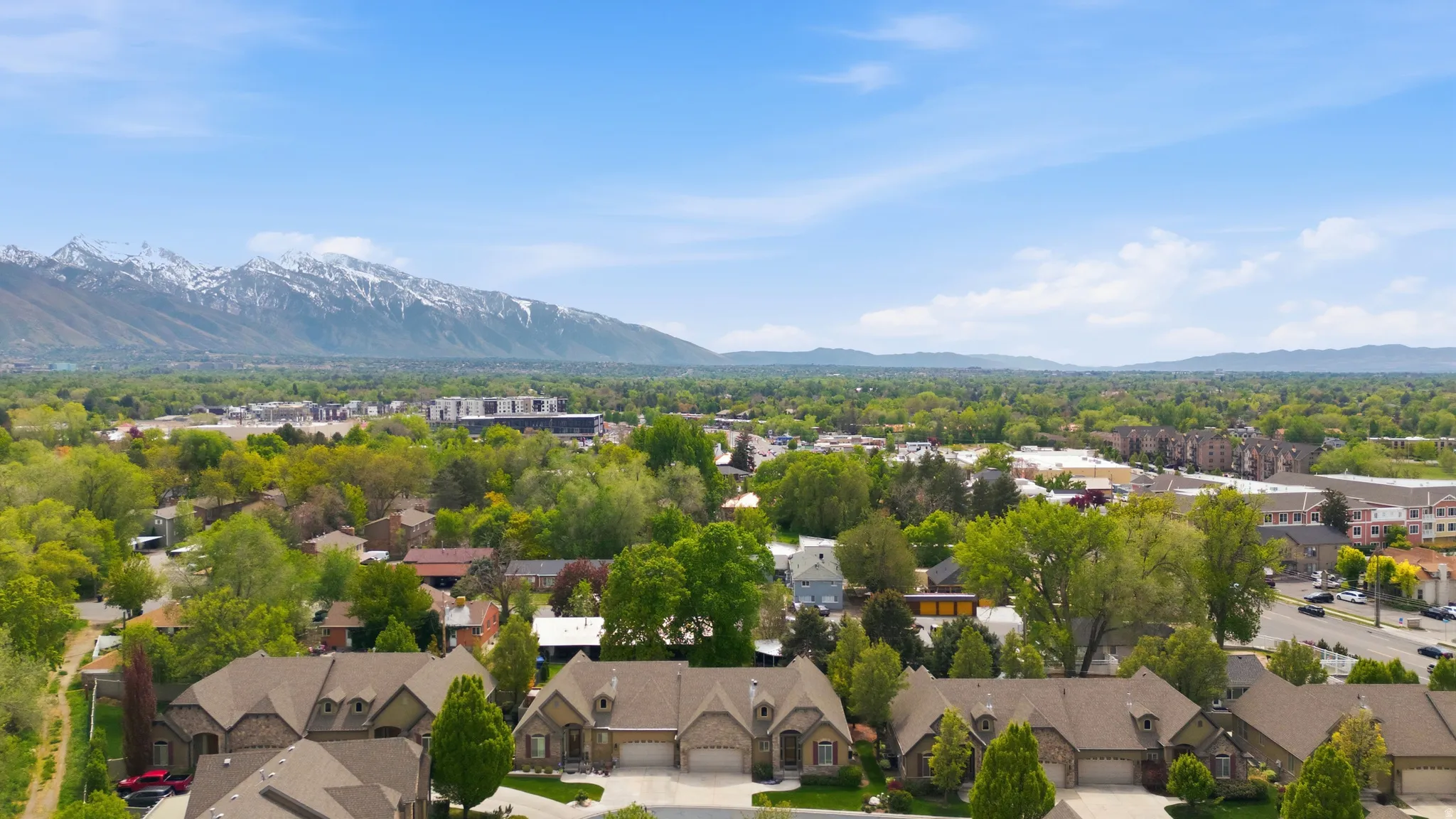 Aerial view of residential area featuring mountains