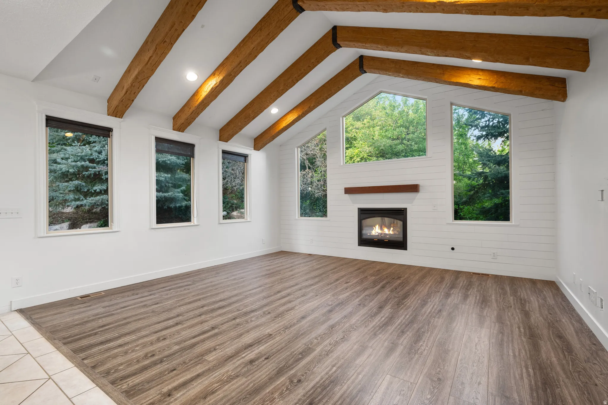 A true showstopper with windows on three sides bringing the outdoors in.