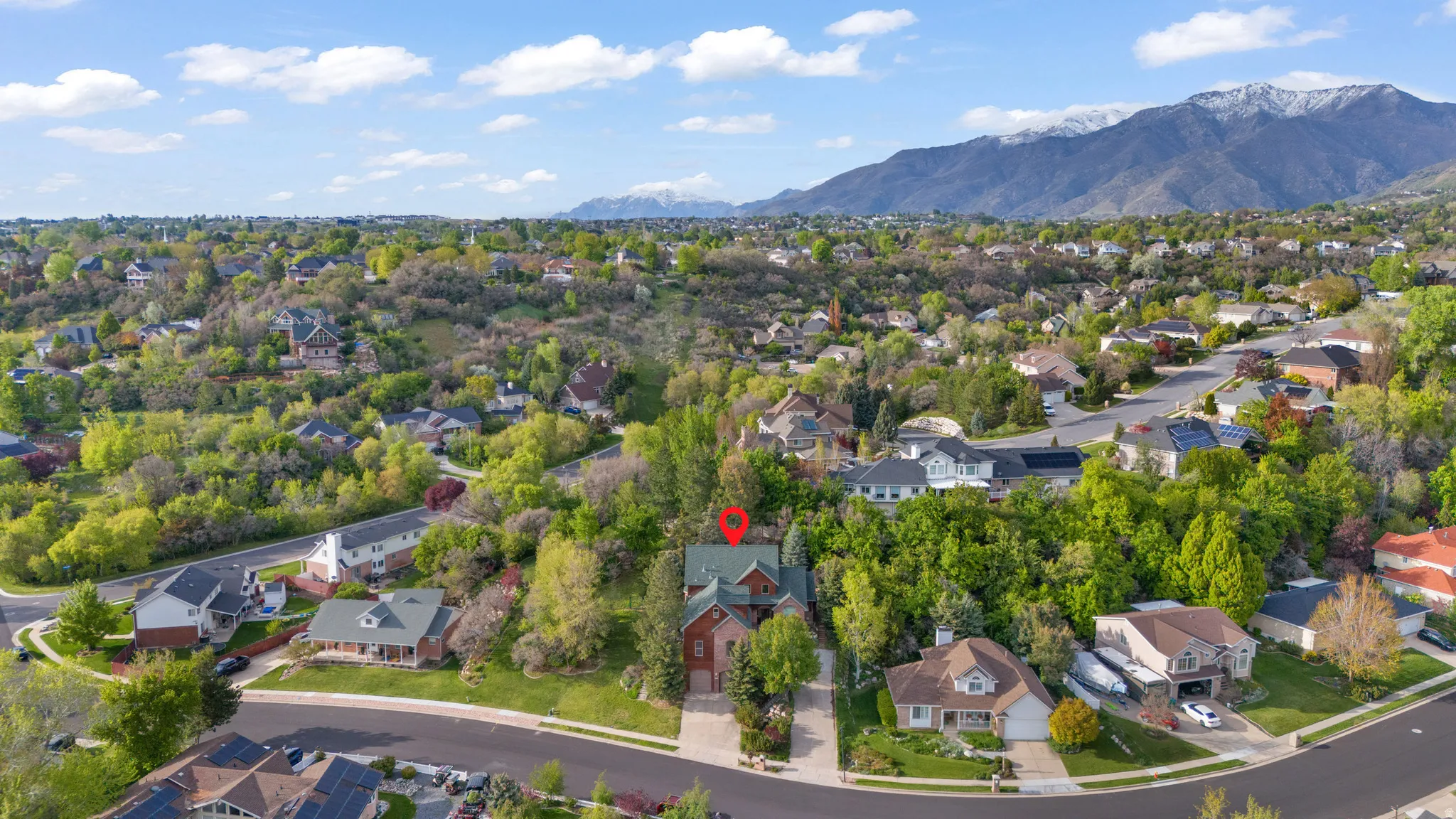 Aerial perspective of suburban area featuring mountains