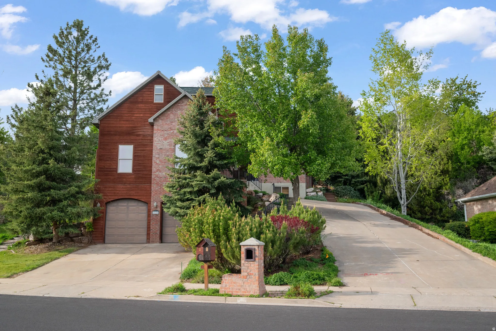 2 driveways, lower garage and to upper garage