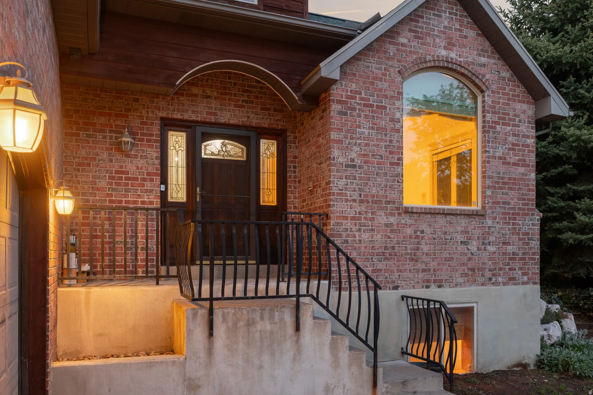 View of exterior entry featuring brick siding