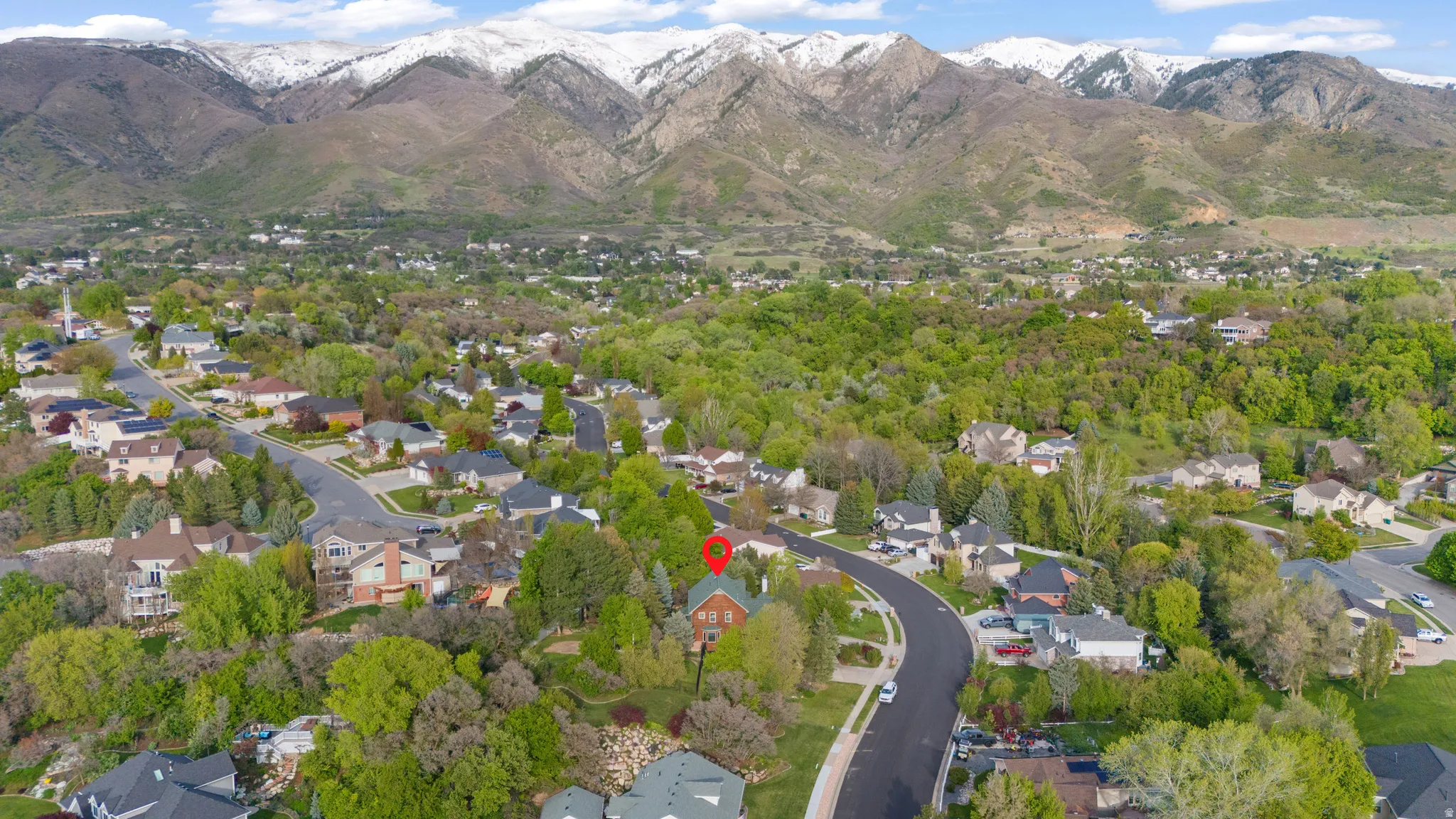 Aerial perspective of suburban area featuring mountains