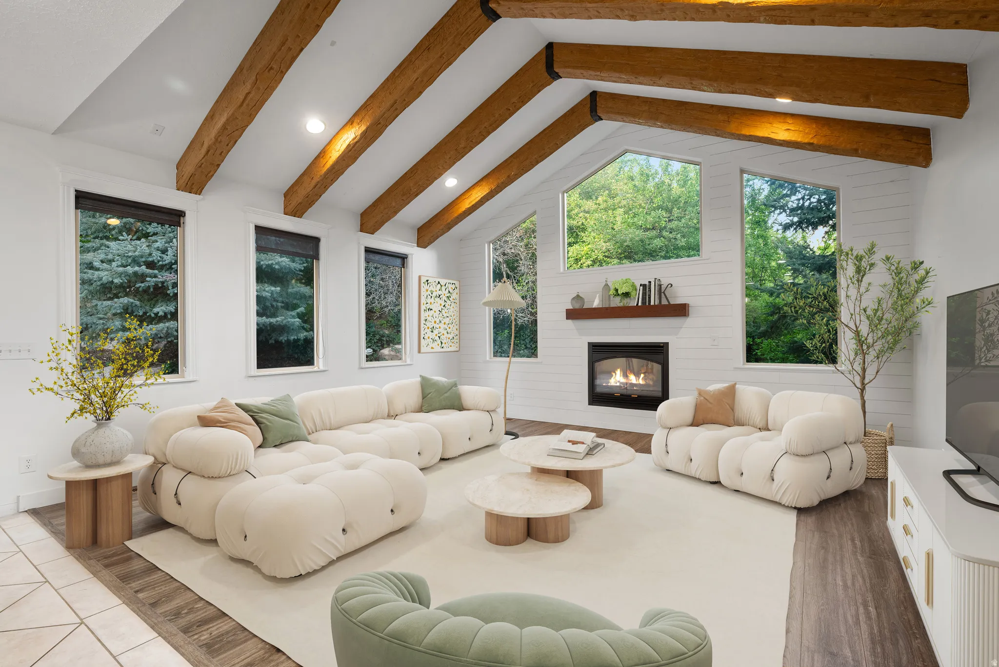 Virtually staged Living Area with recessed lighting, a fireplace, beamed ceiling, plenty of natural light, and dark wood-type flooring