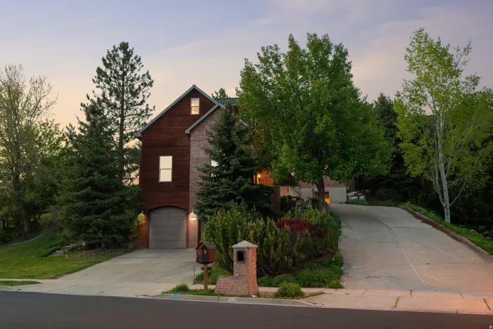 Tucked into the trees on a private, elevated lot this home feels like a mountain retreat from the moment you arrive