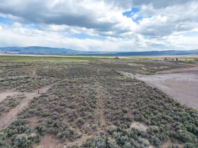 Aerial view of sparsely populated area with a mountain backdrop