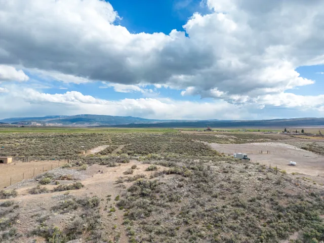 Aerial view of sparsely populated area featuring a mountainous background