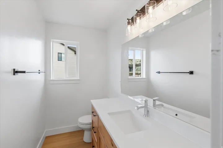 Bathroom featuring vanity and light wood-type flooring