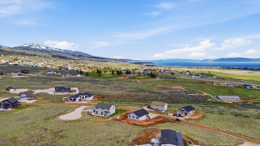 Aerial perspective of suburban area with a mountainous background