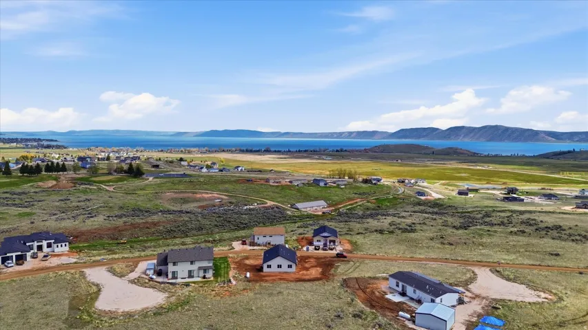 Aerial perspective of suburban area featuring a mountainous background