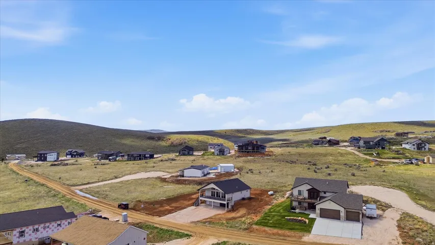 Aerial view of residential area featuring a mountain backdrop