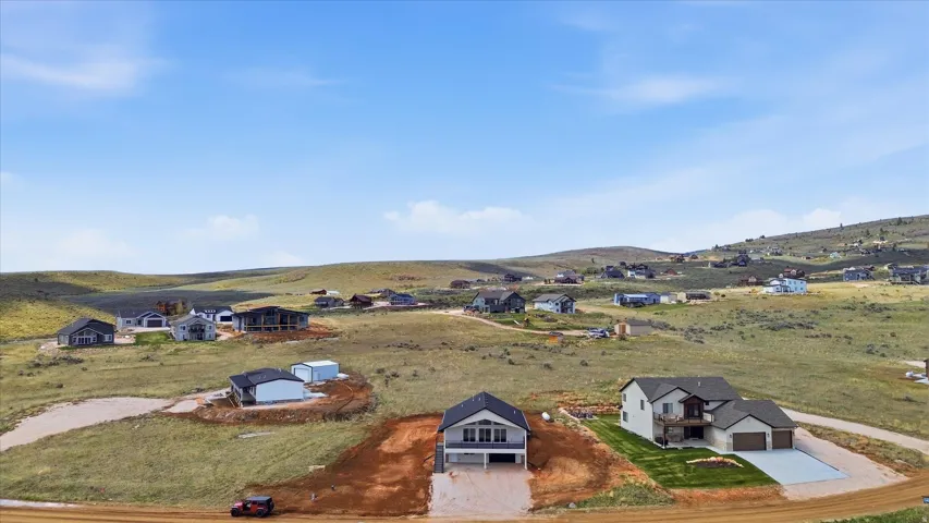 Aerial perspective of suburban area with a mountain backdrop