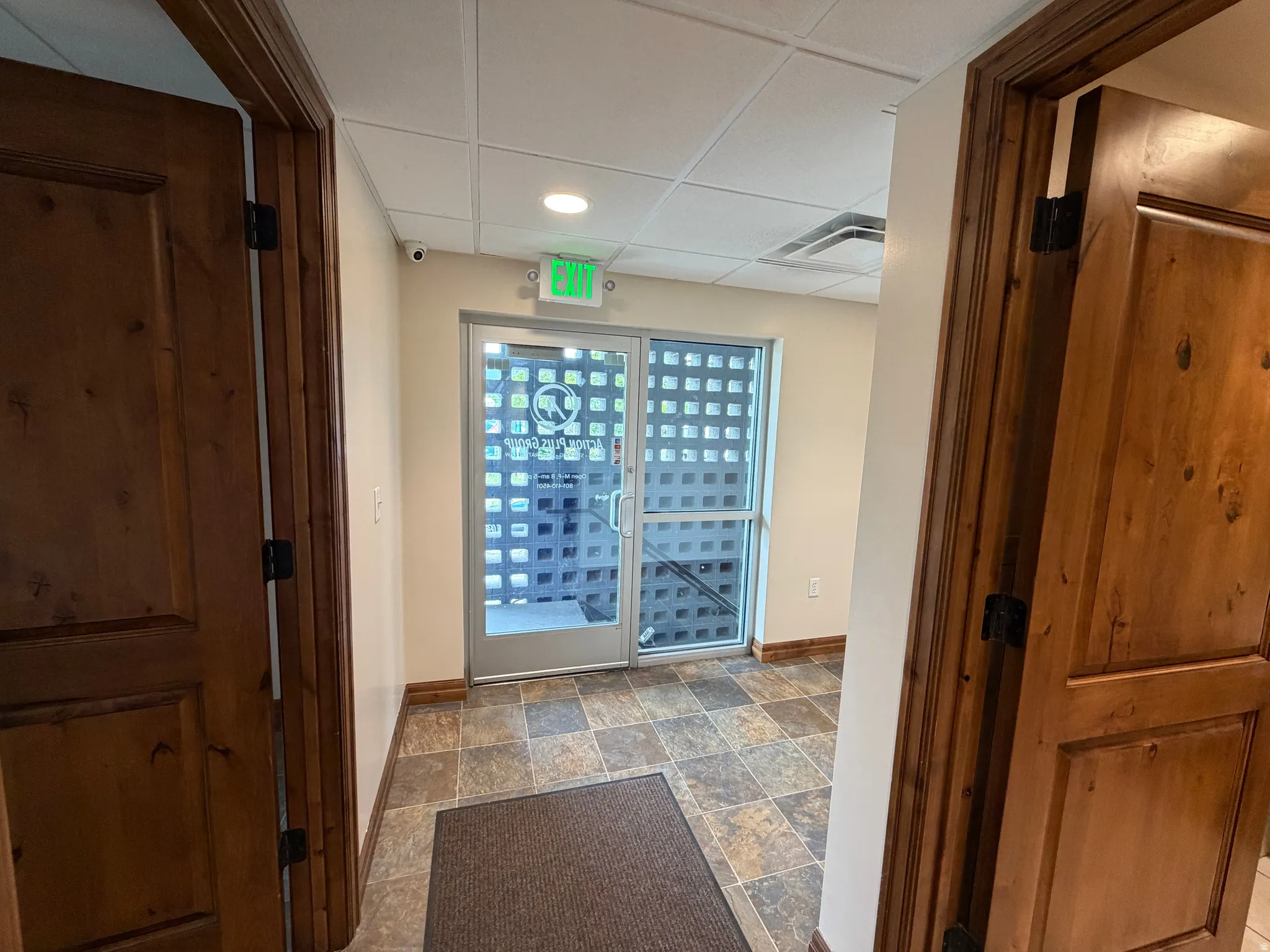 View of property's community featuring a paneled ceiling and recessed lighting