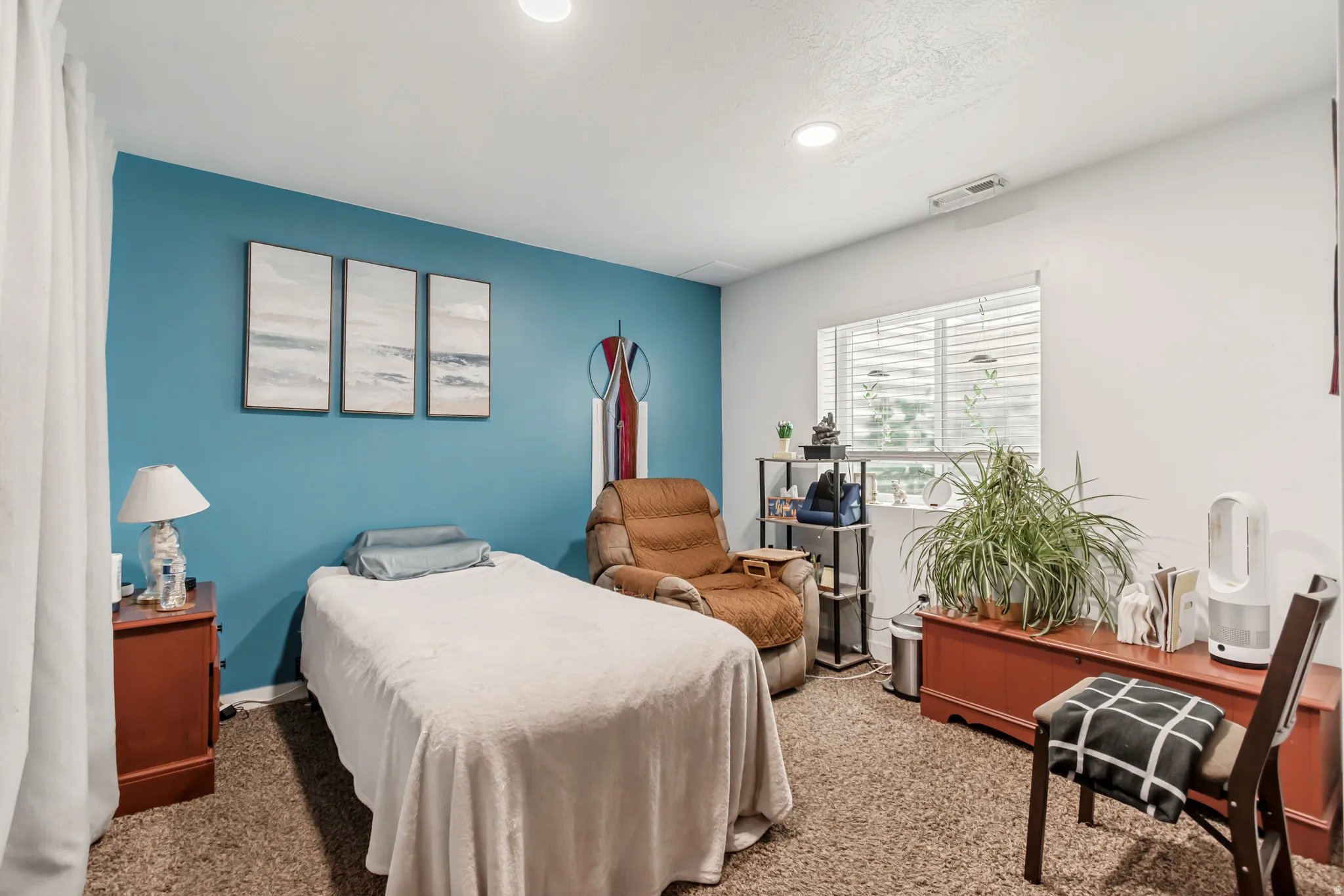 Carpeted bedroom with baseboards