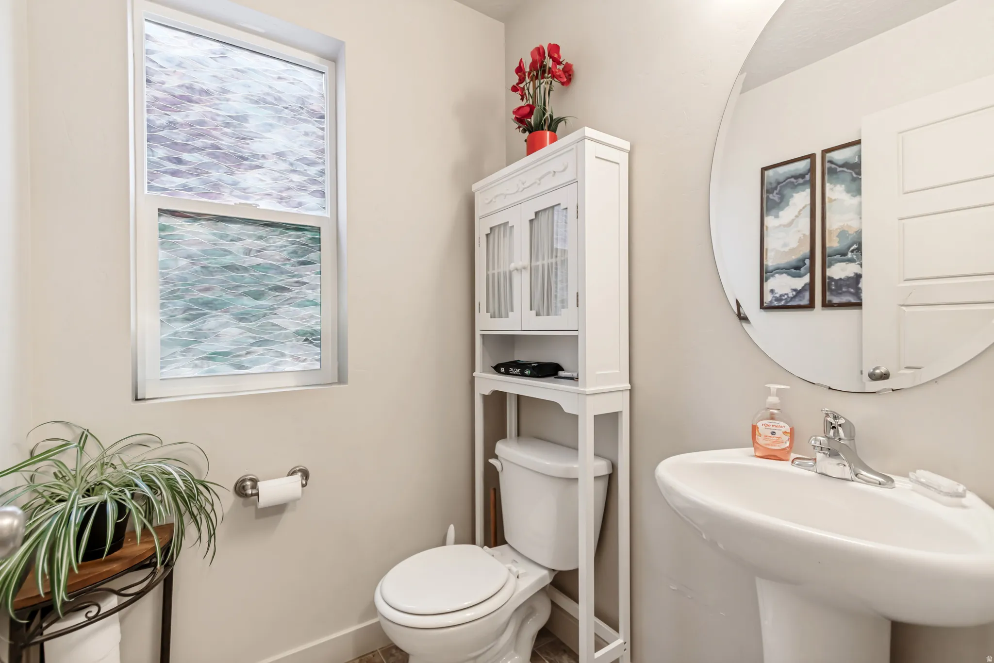 Bathroom featuring toilet and baseboards